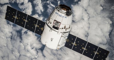 A SpaceX satellite floating above Earth in space